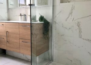 Stunning marble look alike porcelain tiles - bathroom renovation by Master Bathrooms & Kitchens