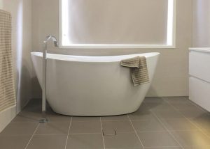 Stunning free standing bath with floor mounted bath filler - bathroom renovation by Master Bathrooms & Kitchens.