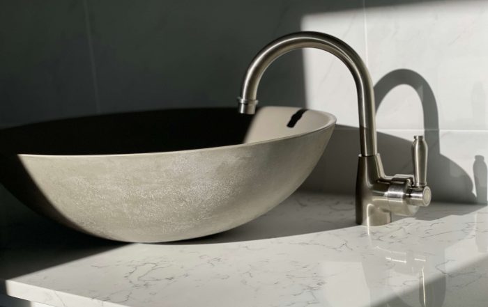 Stone sink paired with custom vanity