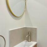 Separate toilet renovation with custom vanity